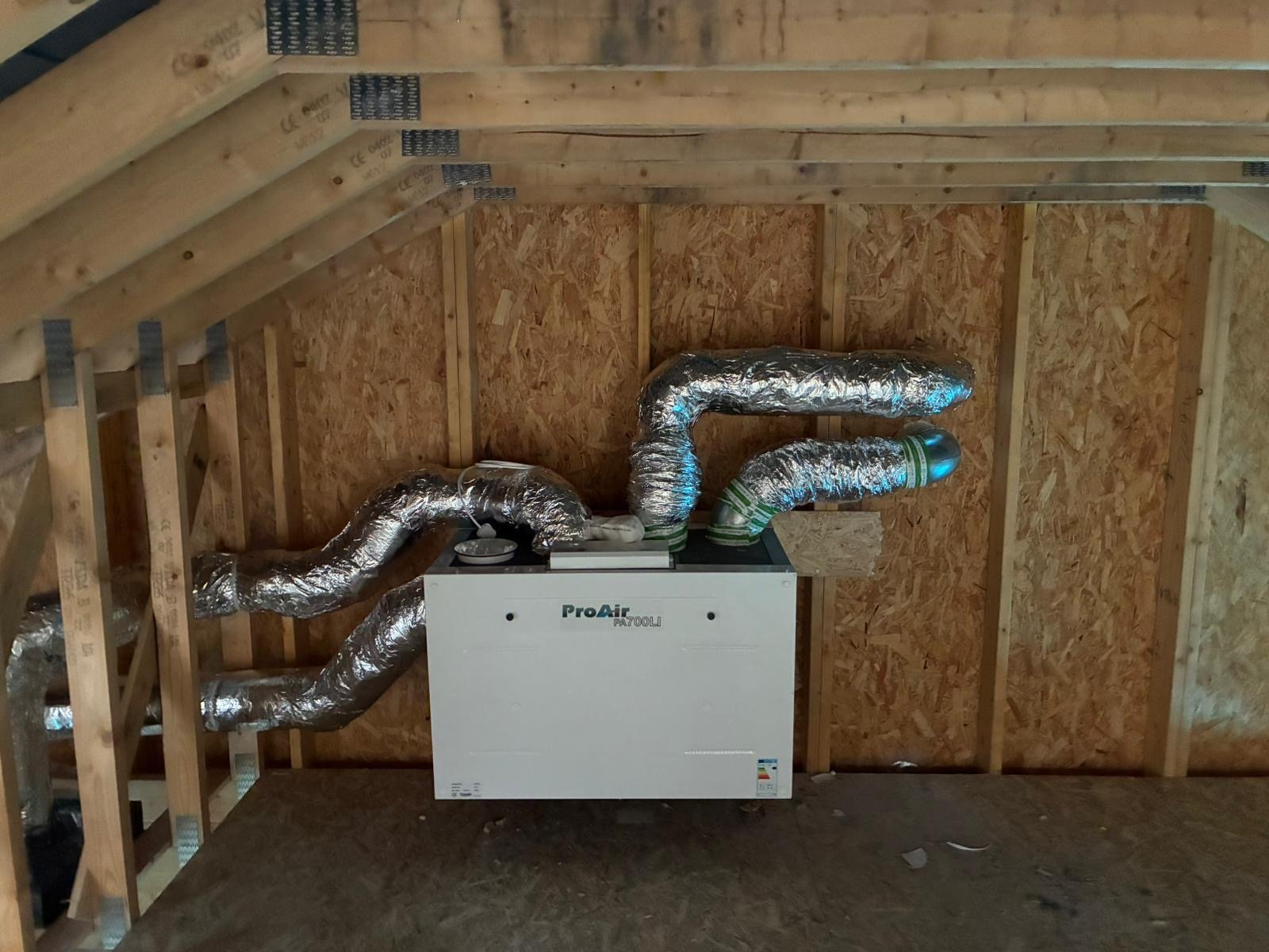 ProAir MVHR unit and ventilation ducts installed in an attic